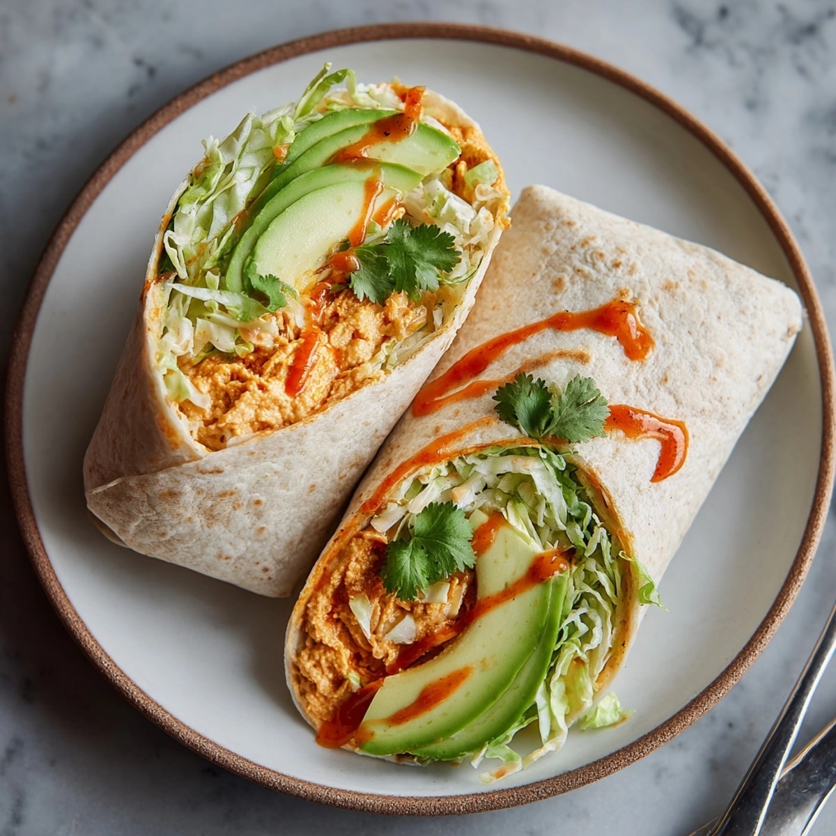 Crisp 10-Minute Buffalo Hummus Tortilla Wraps: imagine creamy, spicy buffalo and fresh textures.