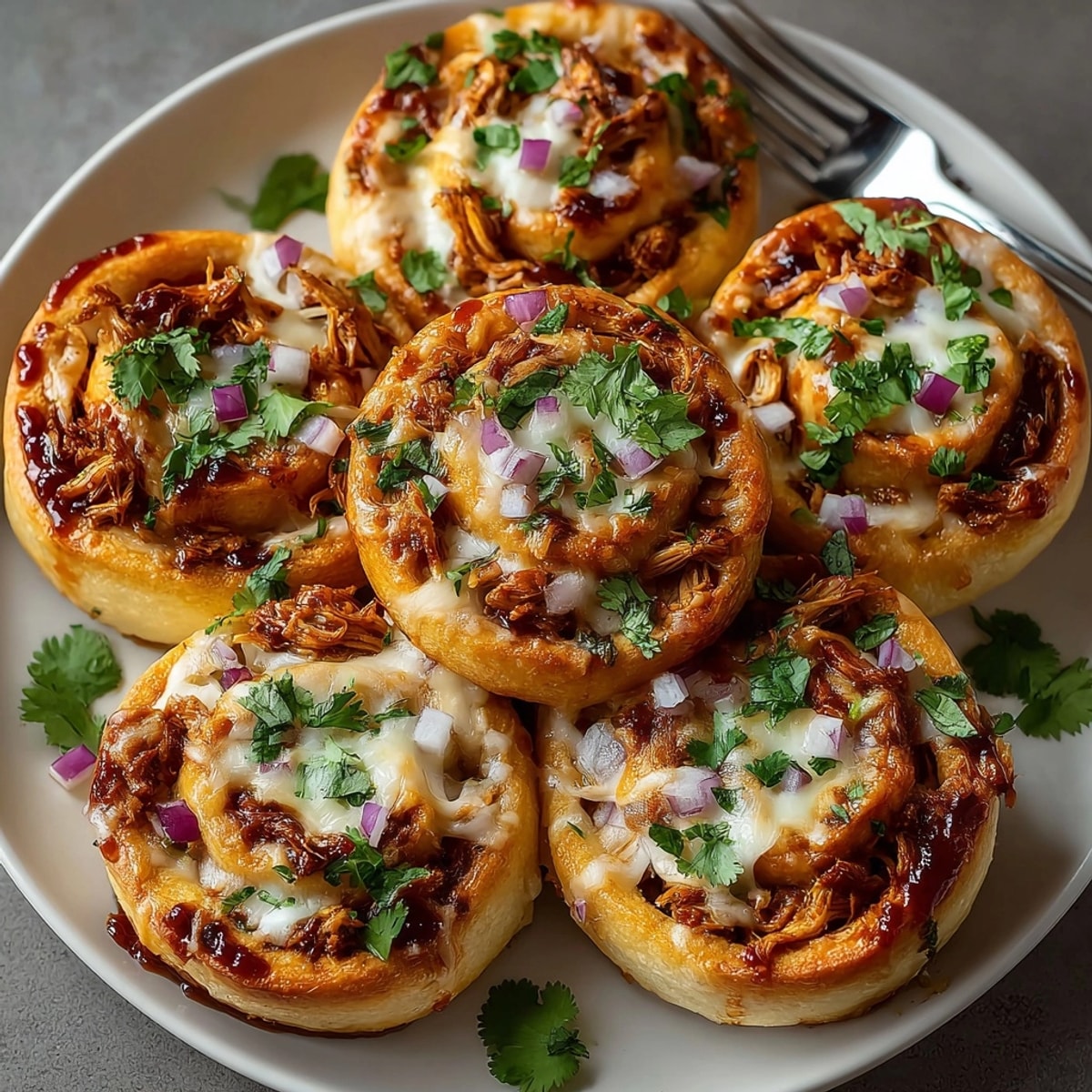 Golden BBQ Chicken Pizza Roll-Ups, fresh from the oven, smell smoky and savory.