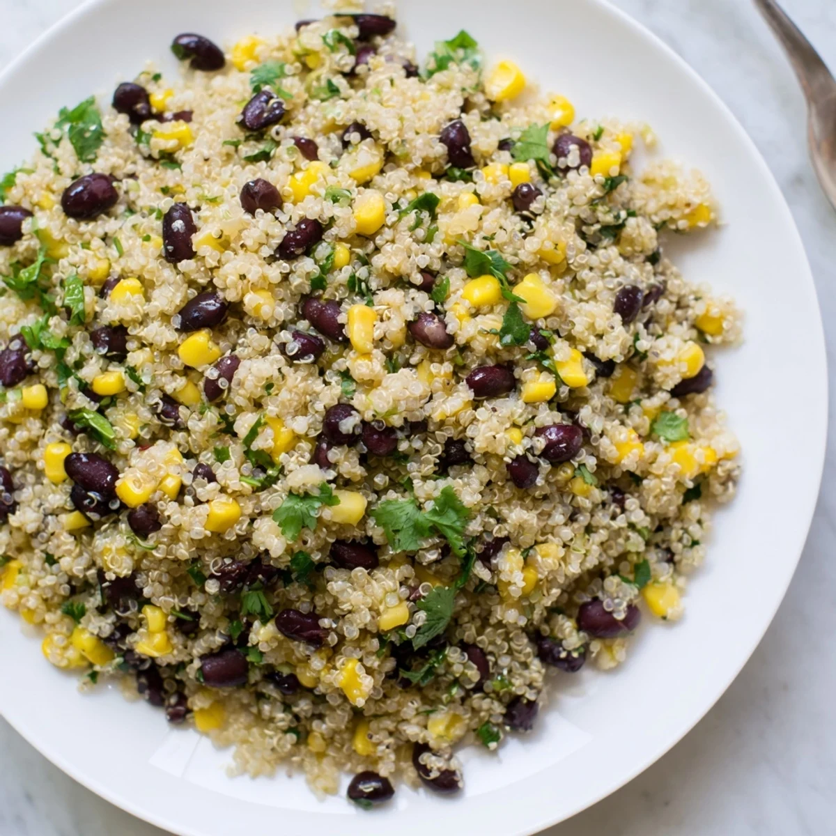 Vibrant Southwest quinoa and black bean salad, perfect for summer potlucks and meal prep.