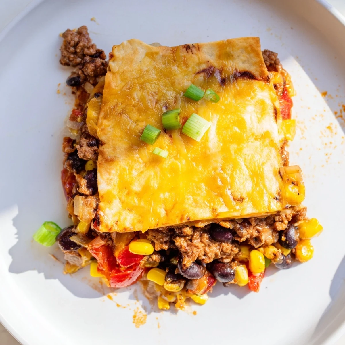 Golden sheet pan quesadillas with beef brimming with flavorful, cheesy fillings, ready to eat.