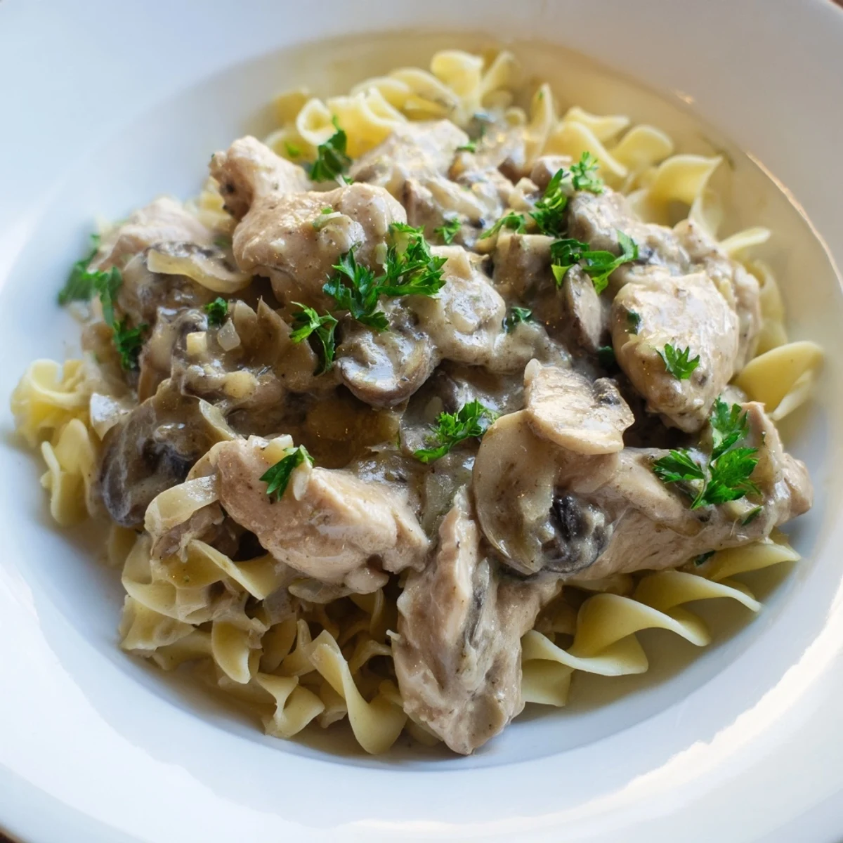 Golden, creamy Creamy Chicken Stroganoff over egg noodles, a comforting dinner ready in minutes.