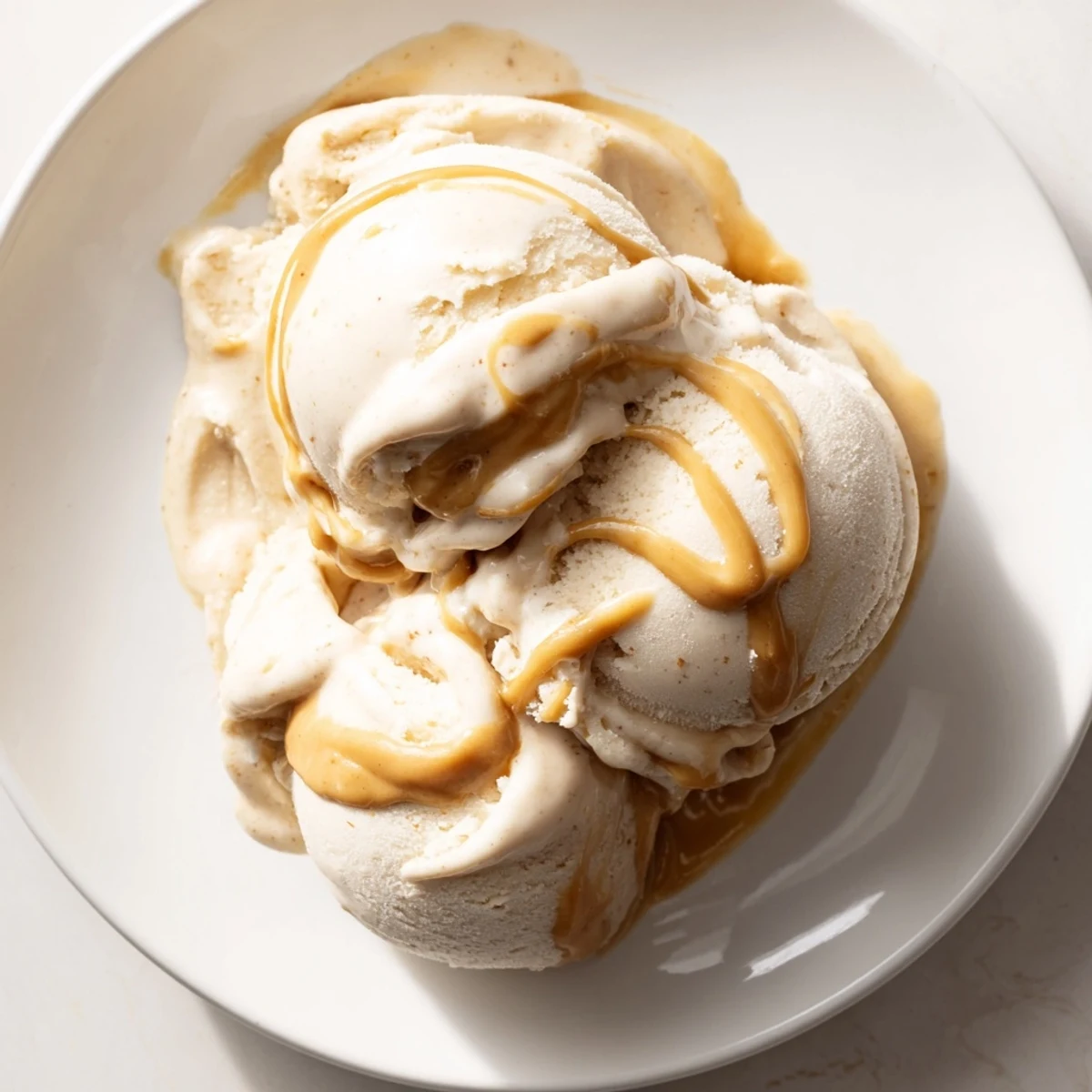 Thick and decadent peanut butter banana ice cream, blended smooth and ready to serve immediately.
