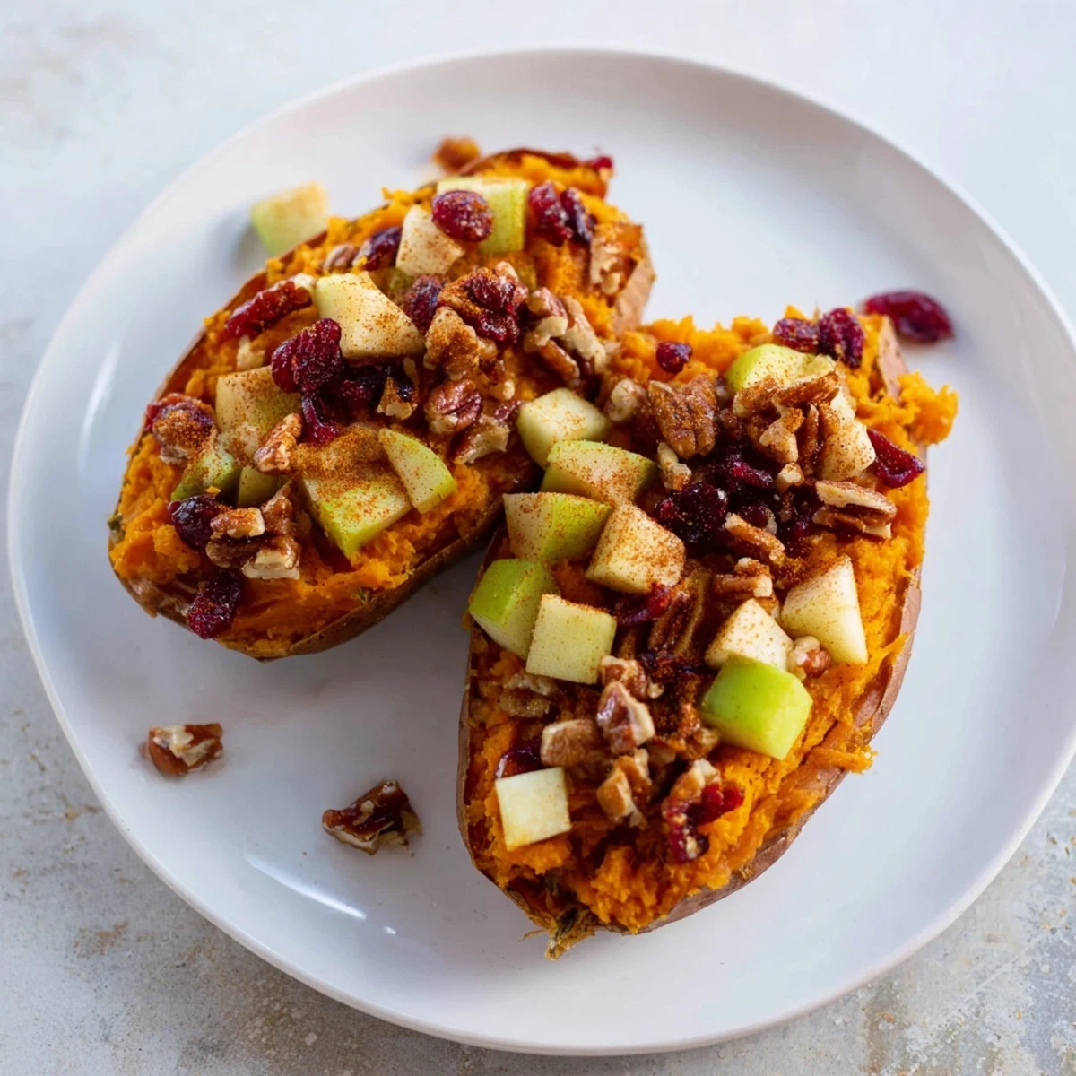 Steaming, flavorful cranberry apple twice-baked sweet potatoes, a perfect vibrant autumn side dish.
