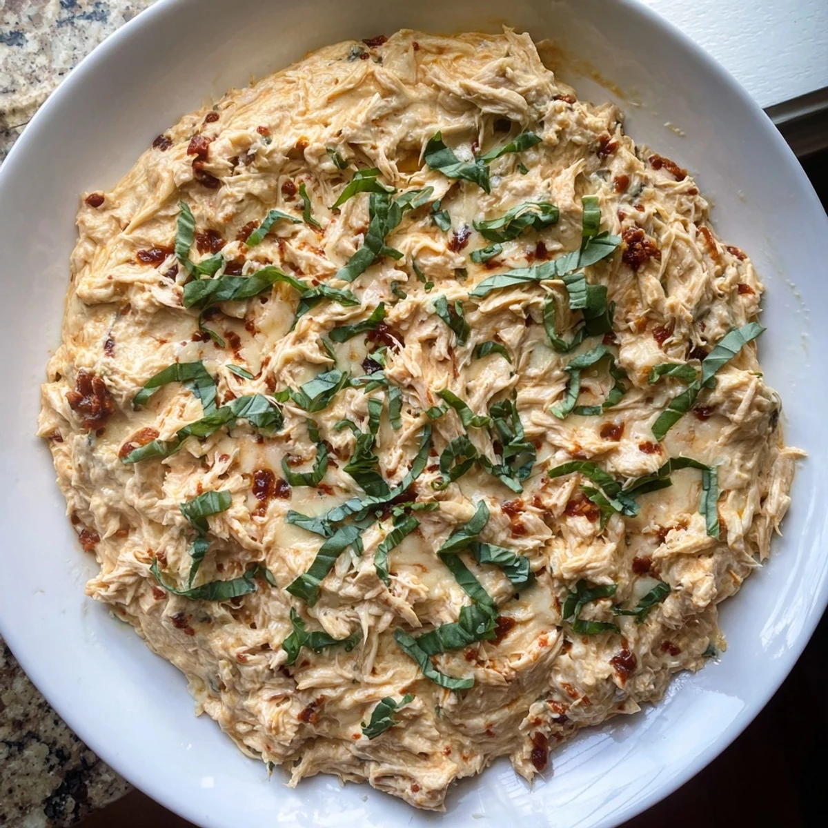 Creamy, golden Lightened Marry Me Chicken Dip, bubbly and perfect with colorful veggie sticks.