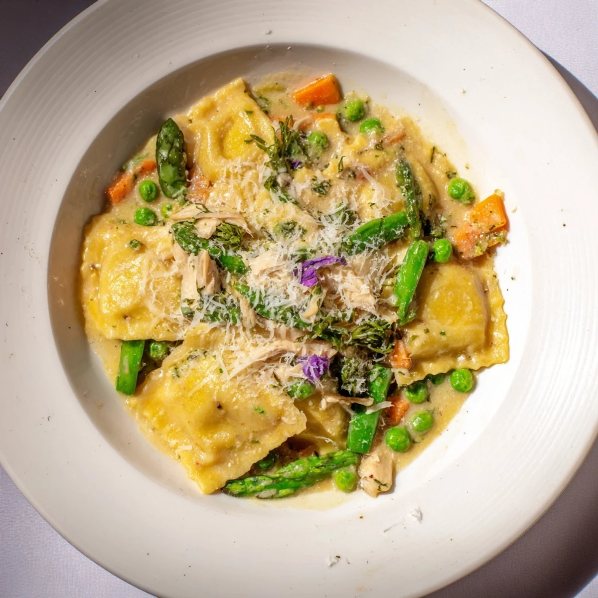 Golden, bubbly Chicken Pot Pie Ravioli Bake fresh from the oven, offering a savory, comforting aroma.