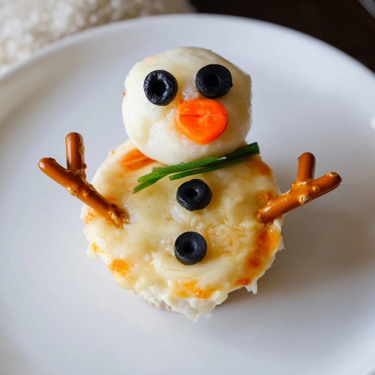 Melted Snowman Cheese Bites are a fun, festive appetizer: creamy snowmen cheese balls perfect for holiday entertaining.