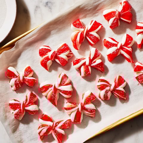 Express Peppermint Candy Bows displayed, shimmery with edible glitter, ready to be enjoyed as a sweet treat.