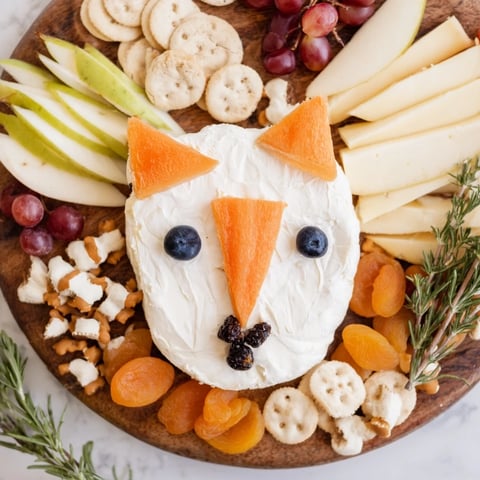 A beautiful Whimsical Fox Fall Treat Board, overflowing with colorful fruits, cheeses, and sweet treats.