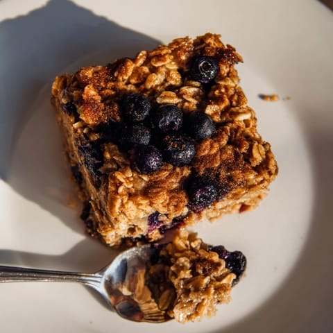 Cozy baked oatmeal with blueberries, perfect for meal prep and wholesome mornings.  