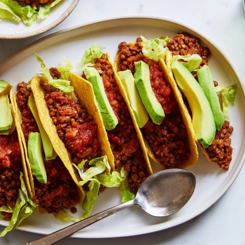 Delicious vegan lentil tacos featuring a spiced filling in warm taco shells.  