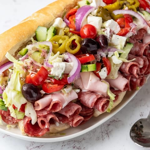 Delicious Flavor Mash-Up Sandwiches bursting with colorful ingredients and creamy dressing.  