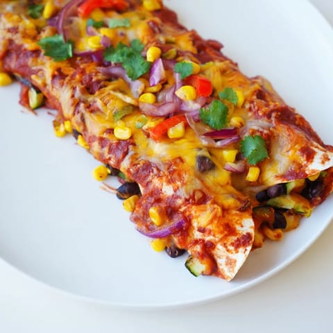 A close-up shot of cheesy Farmers Market Vegetarian Enchiladas, filled with colorful vegetables, perfect dinner.