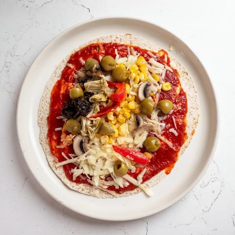 Golden-brown tortilla pizza fresh from the oven, offering a fast and easy pantry meal idea.