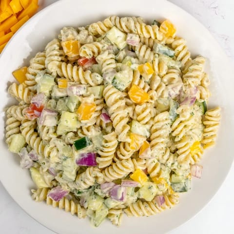 Creamy Dill Pickle Chopped Pasta Salad with crisp vegetables and tangy pickles awaiting you.