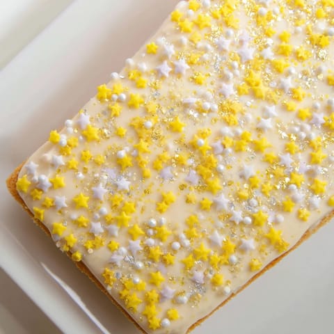 Golden Twinkle Twinkle Star Dessert Bar glistening with vanilla frosting, perfect for any celebration.