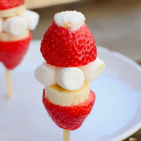 These fun Strawberry Banana Santa Sticks feature red strawberries and sweet banana slices on a skewer.