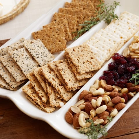 Festive holiday crackers arrayed on a platter, ready to be enjoyed with cheese and dips at your holiday table!