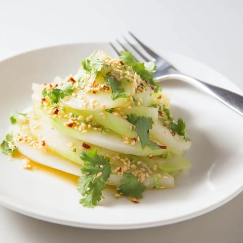 Crisp layers of Jicama and Cucumber Slice Stack, drizzled with zesty dressing and fresh cilantro.