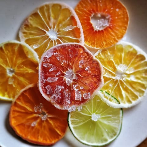 Thinly sliced oranges, lemons, and lime provide beautiful mocktail garnishes, ready to enhance drinks.