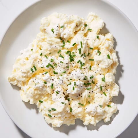 Creamy Cottage Cheese Scrambled Eggs are perfectly cooked, with fresh chives, for a protein boost.