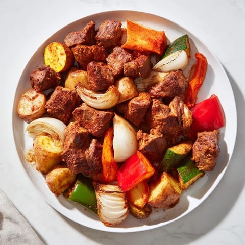 A close-up of a steaming tray of Jordanian Zarb, showcasing fall-off-the-bone lamb with colorful vegetables.