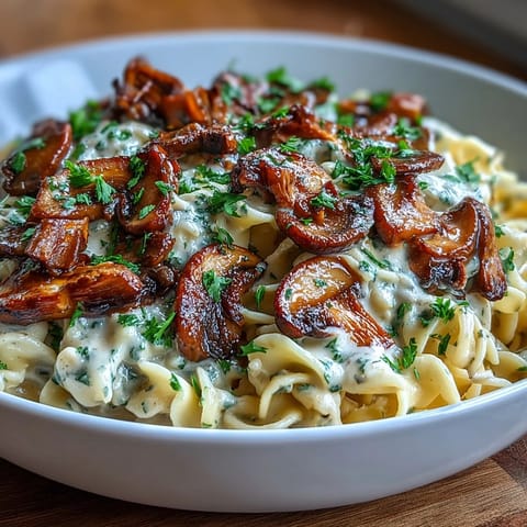 Creamy onion and mushroom stroganoff with tender egg noodles in a rich sour cream sauce.  